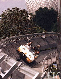 Test vehicle rounding the front of the building